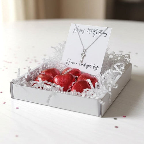 AyeDoGifts 21st birthday gift hamper with sterling silver key charm necklace and red foiled chocolate hearts.