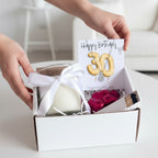 AyeDoGifts 30th birthday hamper with sterling silver necklace, vanilla candle, chocolates, and matches.