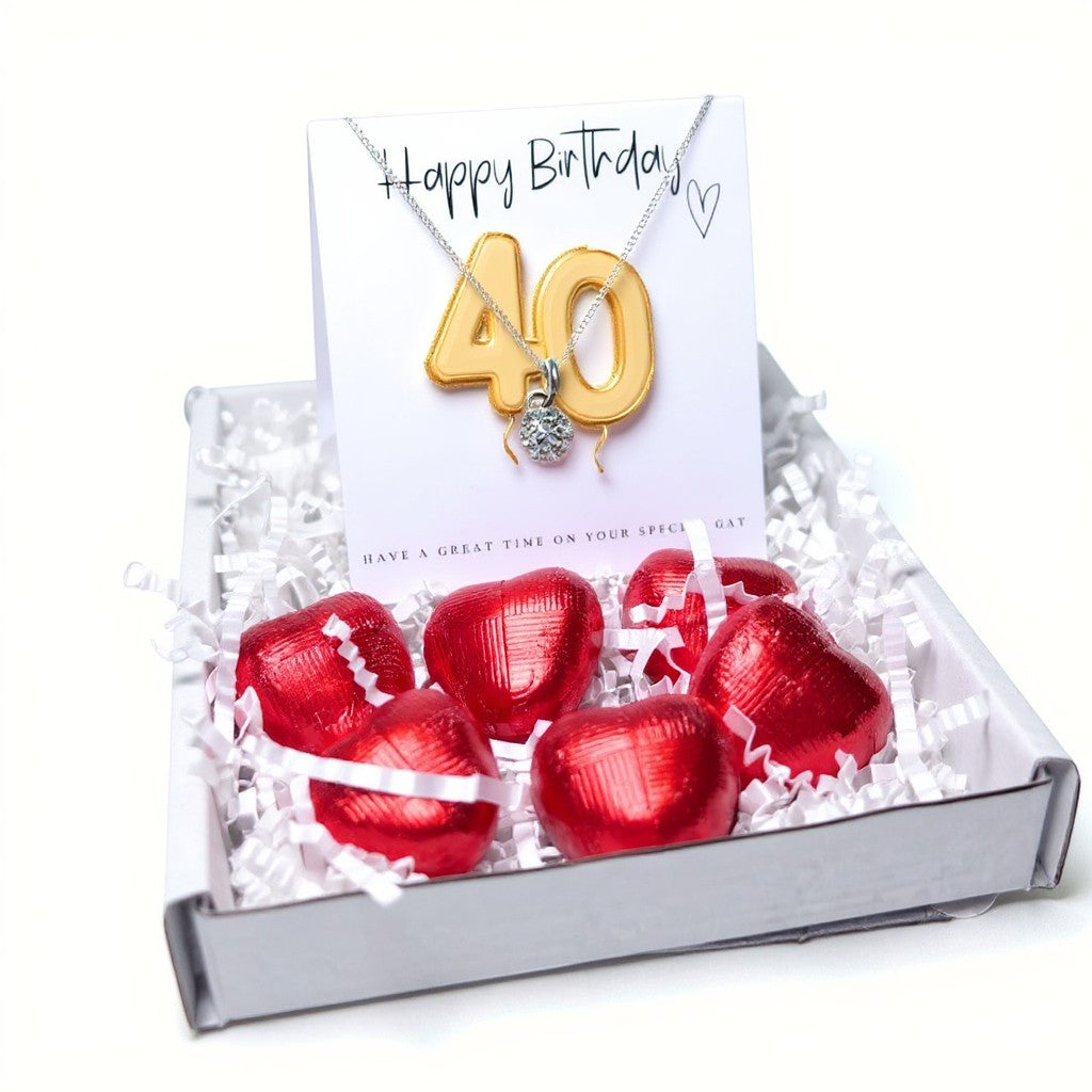 AyeDoGifts 40th birthday gift hamper with silver necklace featuring a cubic zirconia charm and gold '40' balloon design, plus red chocolate hearts.