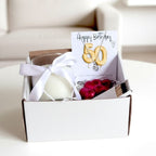 AyeDoGifts 50th birthday hamper with sterling silver necklace, vanilla candle, chocolates and matches.