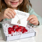 AyeDoGifts sterling silver necklace with pink enamel ballet shoes charm, presented in a gift box with chocolate hearts.