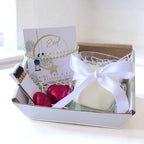 AyeDoGifts Eid Mubarak candle gift set with beaded bracelet, star charm, vanilla candle, and chocolates.