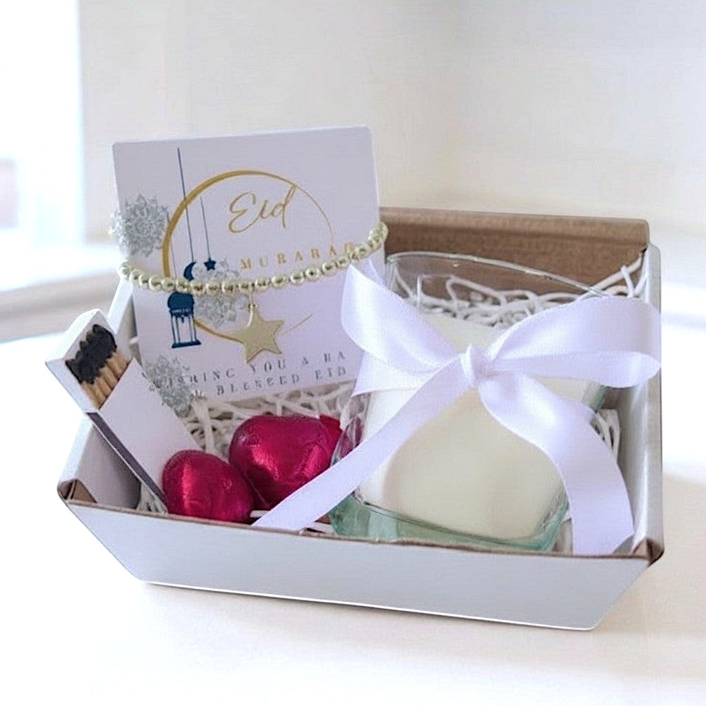 AyeDoGifts Eid Mubarak candle gift set with beaded bracelet, star charm, vanilla candle, and chocolates.