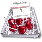 AyeDoGifts pink nylon friendship bracelet with gold enamel fairy charm and red foiled chocolate hearts.